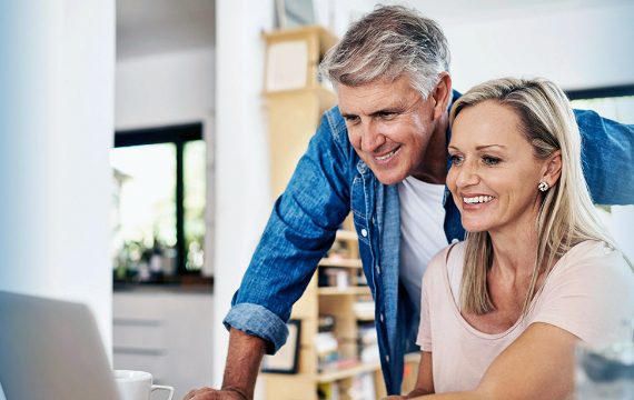 Older couple looking at computer